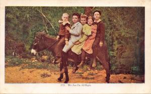 WE ARE ON ALL RIGHT-KIDS RIDING DONKEY POSTCARD 1910s