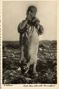 libya, Young Arab Boy enjoys his Kommissbrot (1940s) H. Schlösser Photo