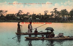Native American Seminole Indians in Dugouts on New River in Florida