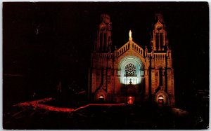 VINTAGE POSTCARD THE BASILICA AT SAINT-ANNE DE BEAUPRE QUEBEC CANADA AT NIGHT