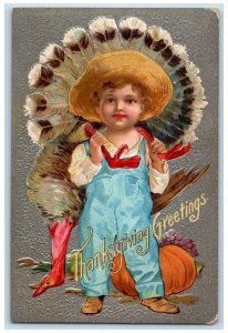 c1910's Thanksgiving Greetings Boy Cached Turkey Fruits Embossed Posted Postcard 