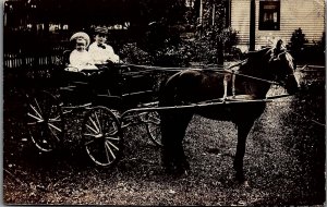 c1910 BOY WITH BOWTIE GIRL DRIVING HORSE DRAWN CART REAL PHOTO POSTCARD 29-160