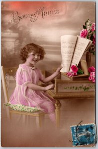 Bonne Anne Pretty Girl Sitting On Chair Playing Piano Greetings Wishes Postcard