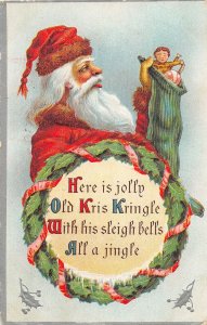 H95/ Santa Claus Christmas Postcard c1910 Stocking Toys Wreath 66