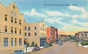 COEUR D'ALENE ID ADAHO~SHERMAN AVENUE-HOTEL-STOREFRONTS~1940s VINTAGE POSTCARD