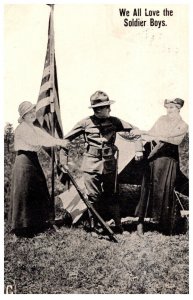 WWI 2 women pulling each arm of soldier, Love our Boys