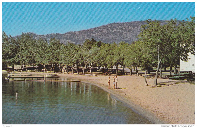 Early morning dip at one of the many beaches at Osoyoos on The Lake,  B.C., C...