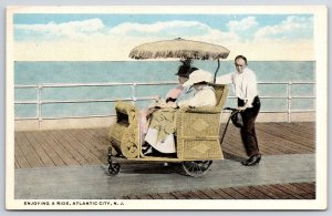 Enjoying A Ride Atlantic City New Jersey NJ Comfortable Boardwalk Postcard