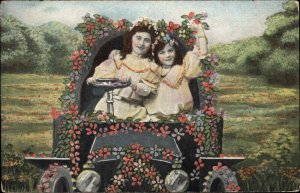 Sisters Young Girls Driving Classic Flower Car c1910 Vintage Postcard