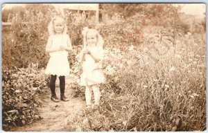 c1910s Cute Happy Little Girls Pick Flowers RPPC Garden Path Fun Real Photo A161