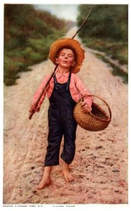 Boy walking Dirt Road going Fishing