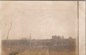 RPPC Early Country Road Trees as Telephone Poles Church in Distance Postcard W20