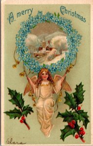 Christmas Postcard Angel Swinging From Forget Me Not Flowers Snowy Church Scene