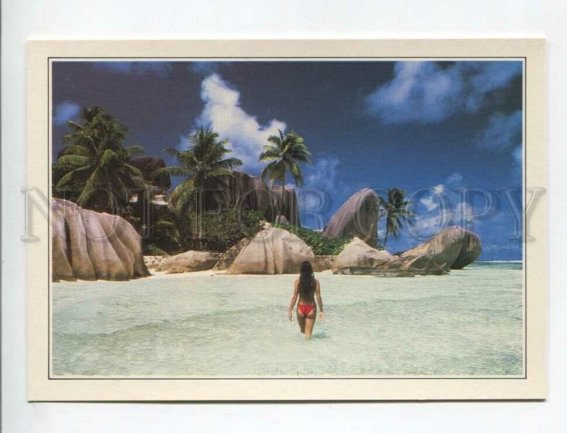 470212 1990 advertising world attractions Seychelles royal cave girl on beach