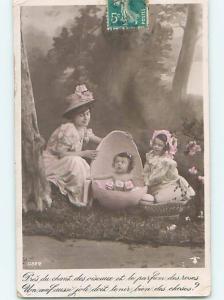 1919 rppc MOM WATCHES BABY IN LARGE EASTER EGG SHELL HM1299