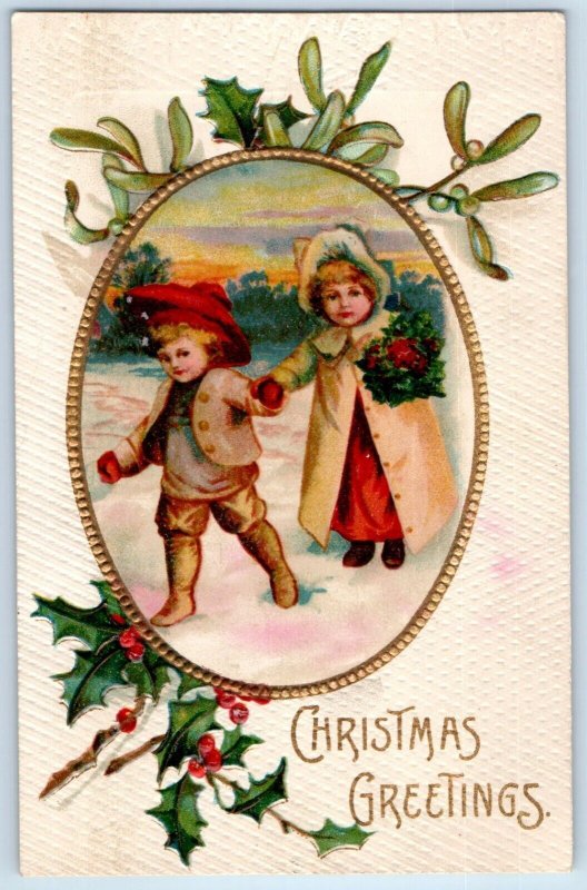 1908 Christmas Greetings Children Winter Scene Holly Berries Embossed Postcard