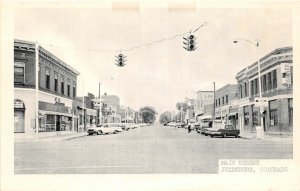 H60/ Julesburg Colorado Postcard c1940s Main Street Stores Automobiles 1