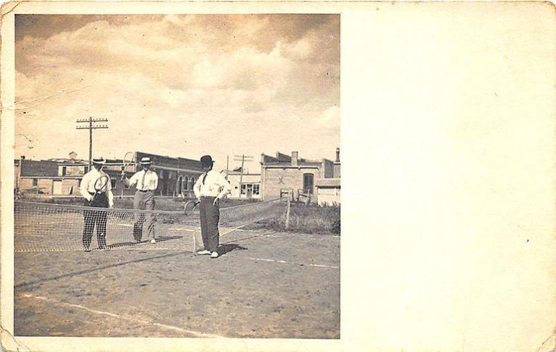 Wilber NE Men on Tennis Court Downtown in Background Real Photo Postcard