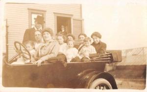 People in Car Real Photo Antique Postcard J55273