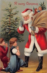 J79/ Santa Claus Christmas Postcard c1910 Children Toy Sack Tree 252