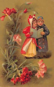 Greetings Children with Song Book Singing Carnation Flowers Postcard AA67824