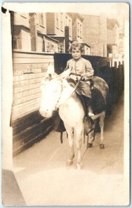 c1900s Cute Little Boy Riding Pony RPPC Town Alleyway Mature Real Photo PC A135