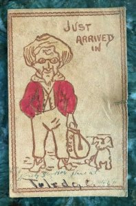 JUST ARRIVED IN TOLEDO OHIO~MAN WITH BAG OF GOLD & DOG~1900s LEATHER POSTCARD