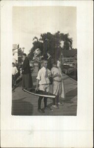 Boy on Dock w/ Model Toy Yacht Ship c1910 Amateur Real Photo Postcard