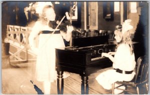 Girls Music Practice Playing Piano And Violin Real Photo RPPC Postcard