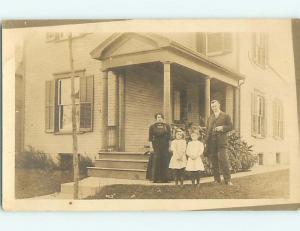 Pre-1918 rppc TWO CUTE GIRLS WITH PARENTS IN FRONT OF HOUSE r5895