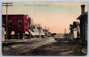 K49/ Wood Lake Minnesota Postcard c1910 Main Street Stores Wagon 464
