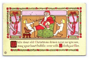 Children Tying Up Santa Claus To Chair Red Robe c1919 Embossed Postcard