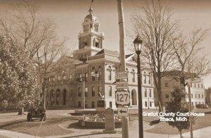 Ithaca Michigan~Caretaker Mows Grass on the Courthouse Lawn~Flower Bed~RPPC 1911 