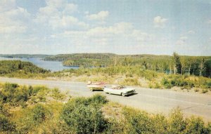 MANITOBA Canada   50s CONVERTIBLE CARFins Towing FISHING BOAT    Postcard