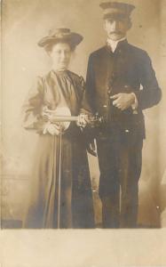 1914 RPPC Salvation Army Man in Uniform w/ Bible, Woman & Violin, Music Religion