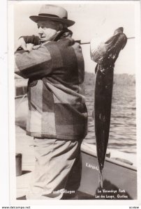 RP: Man with fish,O'Connell Lodge, Lac des Loups, Quebec , Canada , PU-1950