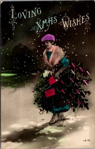 Hand Colored Real Photo Postcard Woman Carrying a Tree Through the Snow