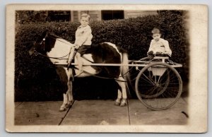 RPPC Young Barefoot Boy on Pony with Sister in Cart John and Clara Postcard E29