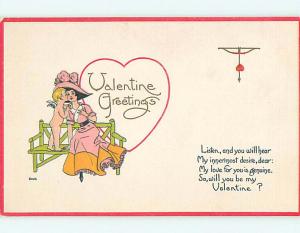 Divided-Back valentine CUPID WHISPERS TO GIRL ON BENCH r4056