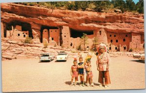 Cliff Dwellings, Colorado Springs  Native American man with boys and old cars