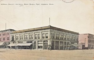 FORT MORGAN COLORADO~MORGAN COUNTY NATIONAL BANK BLOCK-STOREFRONTS~1913 POSTCARD