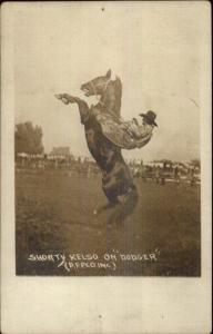 Rodeo - Cowboy Shorty Kelso on Dodger c1920 Real Photo Postcard