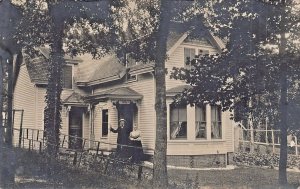 MAN & WOMAN AT FRONT DOOR OF VICTORIAN STYLE HOUSE~1910s REAL PHOTO POSTCARD