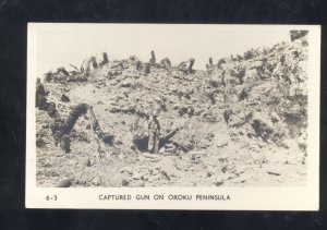 RPPC WWII BATTLE ACTION OROKU PENINSULA CAPTURED GUN VINTAGE REAL PHOTO POSTCARD