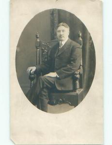 Chipped Pre-1930 rppc ORNATELY CARVED WOODEN CHAIR & MAN IN SUIT o2094
