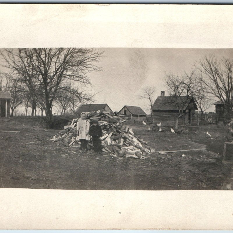 c1910s Outdoor Kids by Chopped Wood Pile RPPC Farm Shed Dog Outhouse Boy A255