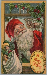 SMILING SANTA with TOYS CHRISTMAS ANTIQUE POSTCARD