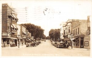 J70/ Hartford Wisconsin RPPC Postcard c40-50s Main St Stores 47