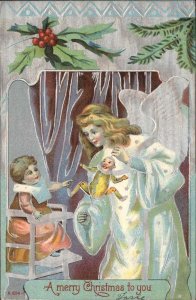 Christmas Child in High Chair Angel Toy Doll Embossed c1900s-10s Postcard