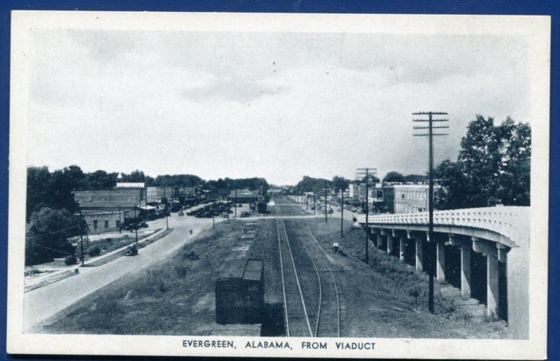 Evergreen Alabama al view from Viaduct railroad boxcars tracks Rexall postcard